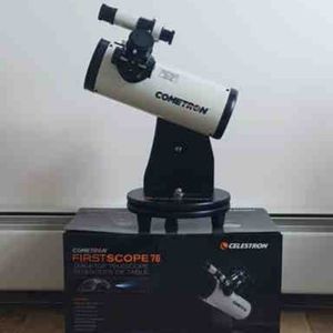 Celestron cometron telescope. Like new on stand with swivel and accessories.